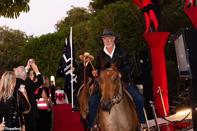 The riders carried whips and were dressed in iconic coat-maker Driza-Bone, which Mrs Rinehart bought last year (pictured)